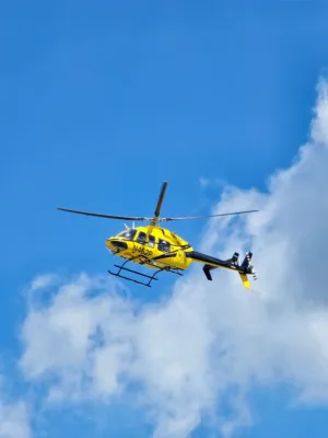 Yellow Helicopter In Flight