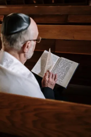 Man Reading A Book In A Synagogue