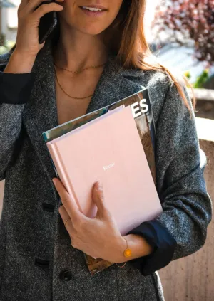 Businesswoman With Magazine And Notebook