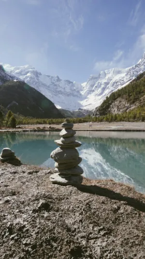 Mountain Lake With Stone Cairn