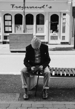 Man Sitting On Bench