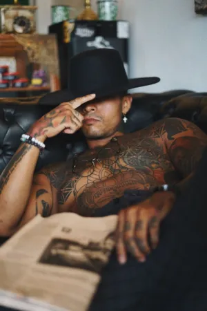 Tattooed Man With Hat