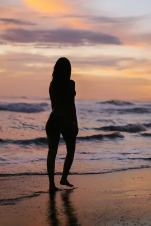 Silhouette Of A Woman At Sunset