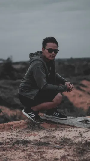 Crouching Man In Nature