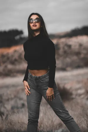 Fashion Model In Black Crop Top And Gray Jeans