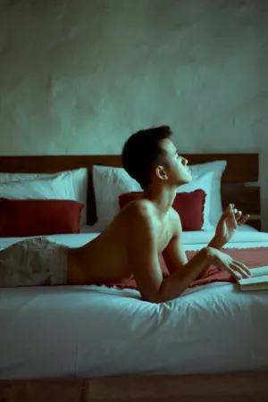 Relaxed Man On Bed