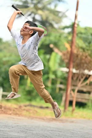 Boy Playing Badminton