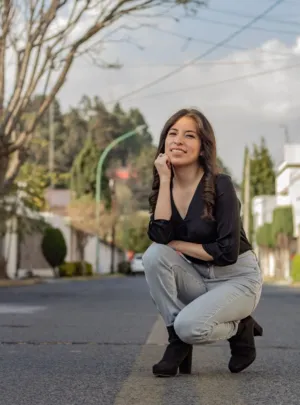 Crouching Woman On Street