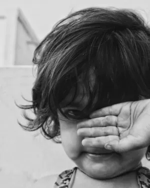 Child Covering Face