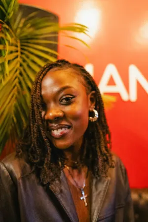 Smiling Woman In Leather Jacket