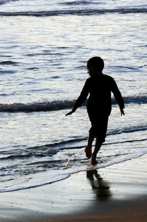 Child Running On Beach
