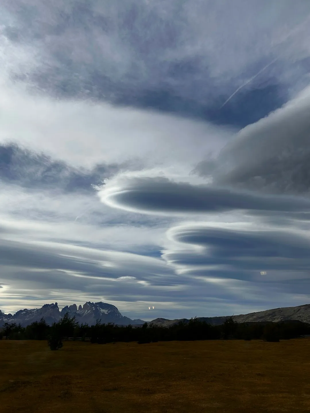 Lenticular Clouds Over Mountains