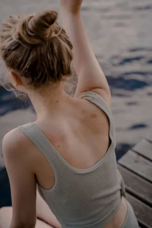Young Woman In Grey Top