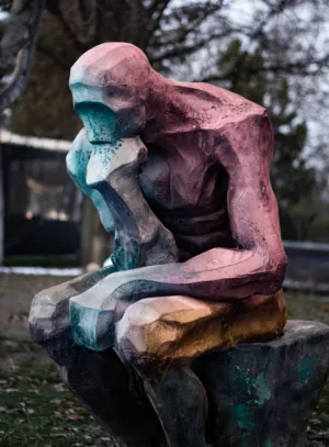 Colorful Sculpture Of A Seated Figure