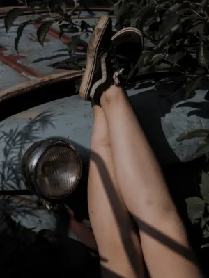 Legs On Rusty Car