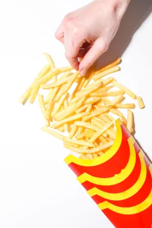 Hand Grabbing French Fries