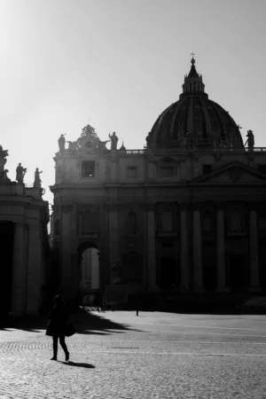Silhouette Of A Person Walking In Front Of St. Peter'S Basil