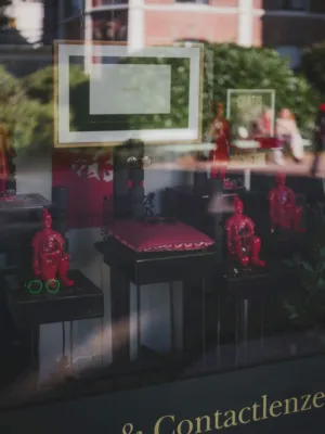 Window Display With Red Figurines