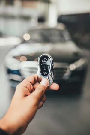 Hand Holding Mercedes Key