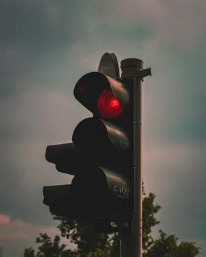 Red Traffic Light At Dusk