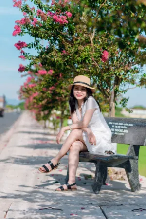 Woman In White Dress And Straw Hat