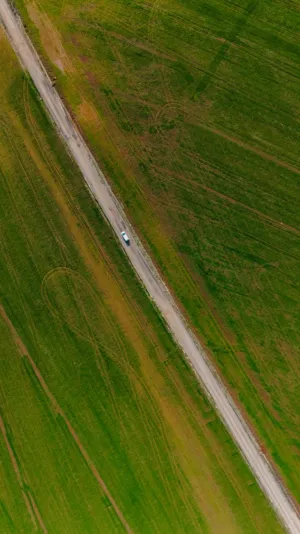 Aerial View Of A Car On A Country Road