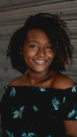 Smiling Woman In Floral Top
