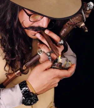 Man Lighting A Cigar